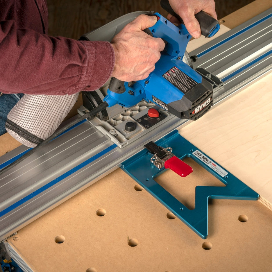 Man holding Kreg Track Saw with TSO Products Guide Rail Square attached to guide rail 
