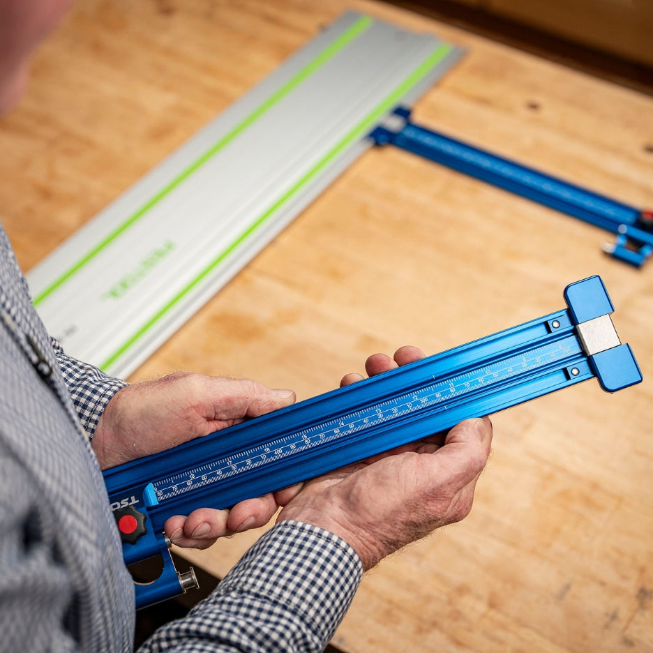 Person holding a TSO Parallel Guide Track with Drop-Loc connector