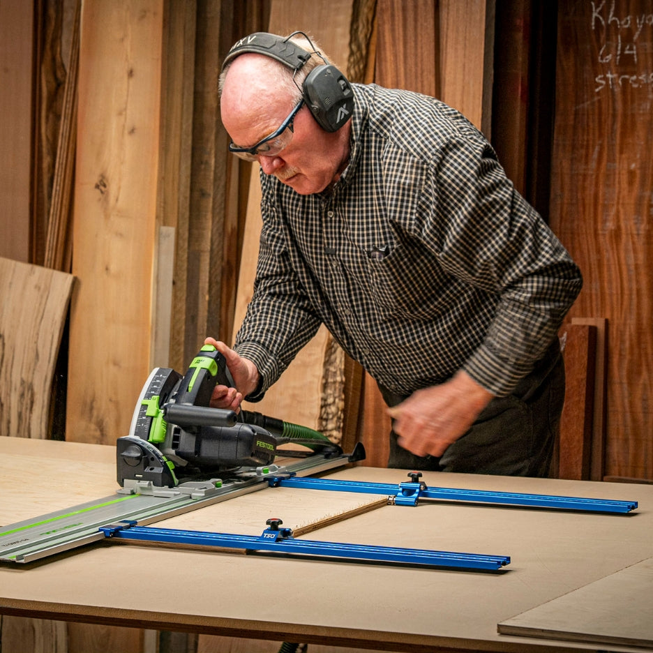 Man using Festool track saw on Festool guide rail and TSO Parallel Guide System Gen 2