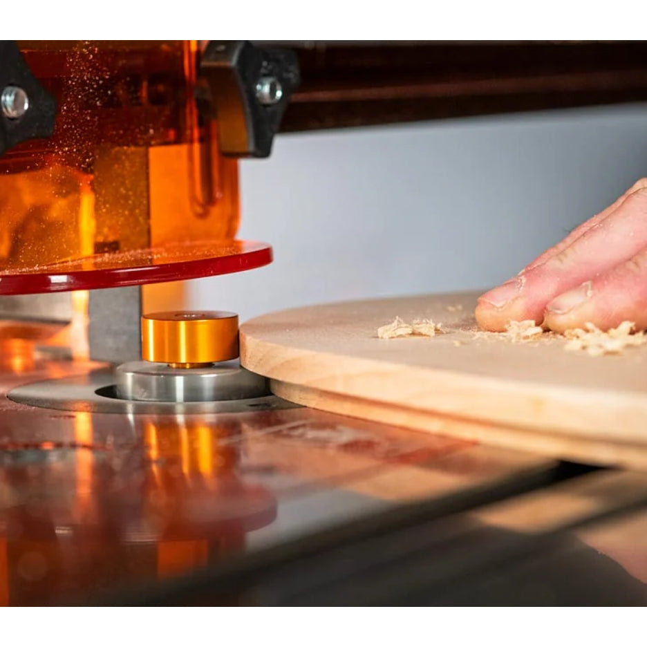 Router with UJK Tools 2-Flute Metric Multi-Rabbetting Router Bit with 1/2 Inch Shank in operation with a person's hand holding a wooden board.