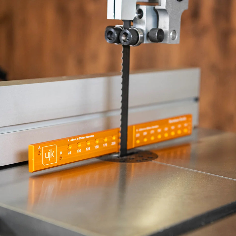 Bandsaw Buddy attaches to bandsaw blade with rare earth magnets to indicate the angle of the blade.
