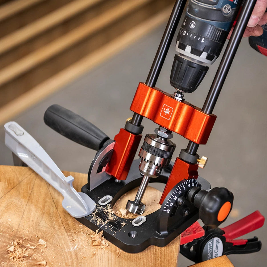 Drill attached to Drill Guide with 10mm Chuck and drilling on a piece of wood