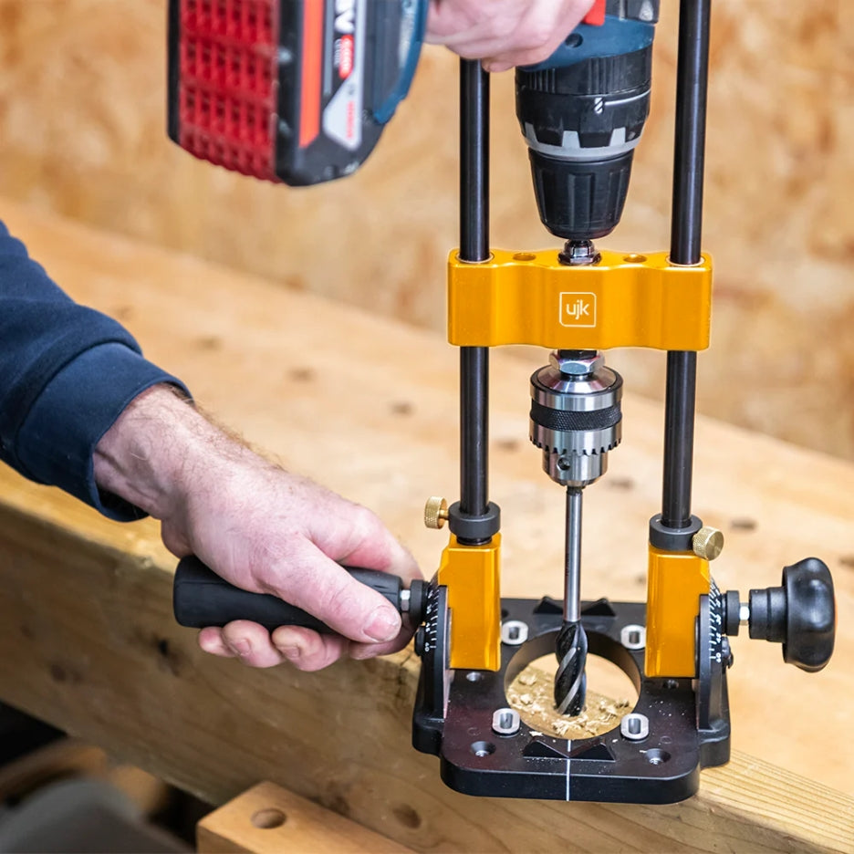 Drill Guide with 10mm Chuck with drill bit being adjusted on a wooden surface
