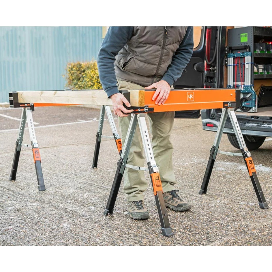Person adjusting a piece of wood to the  UJK Tools Sawhorses 
