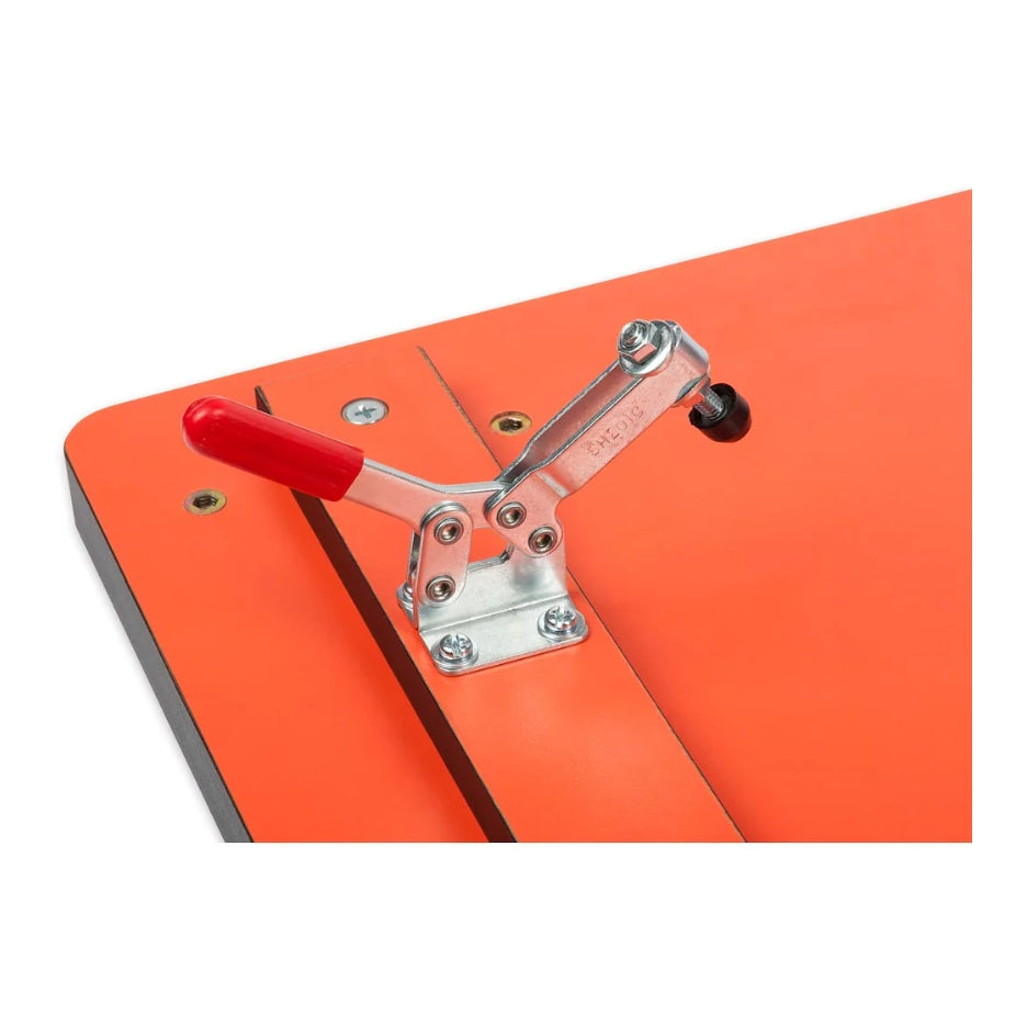 Close-up of a red handle and metal clamp on the UJK Tools Table and Fence for Pillar Drills