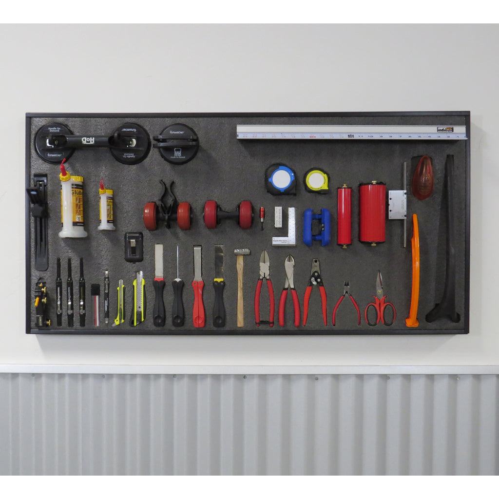 A variety of handtools are neatly organized in a 2x4' piece of Kaizen foam attached to a wall with Kaizen Frame.