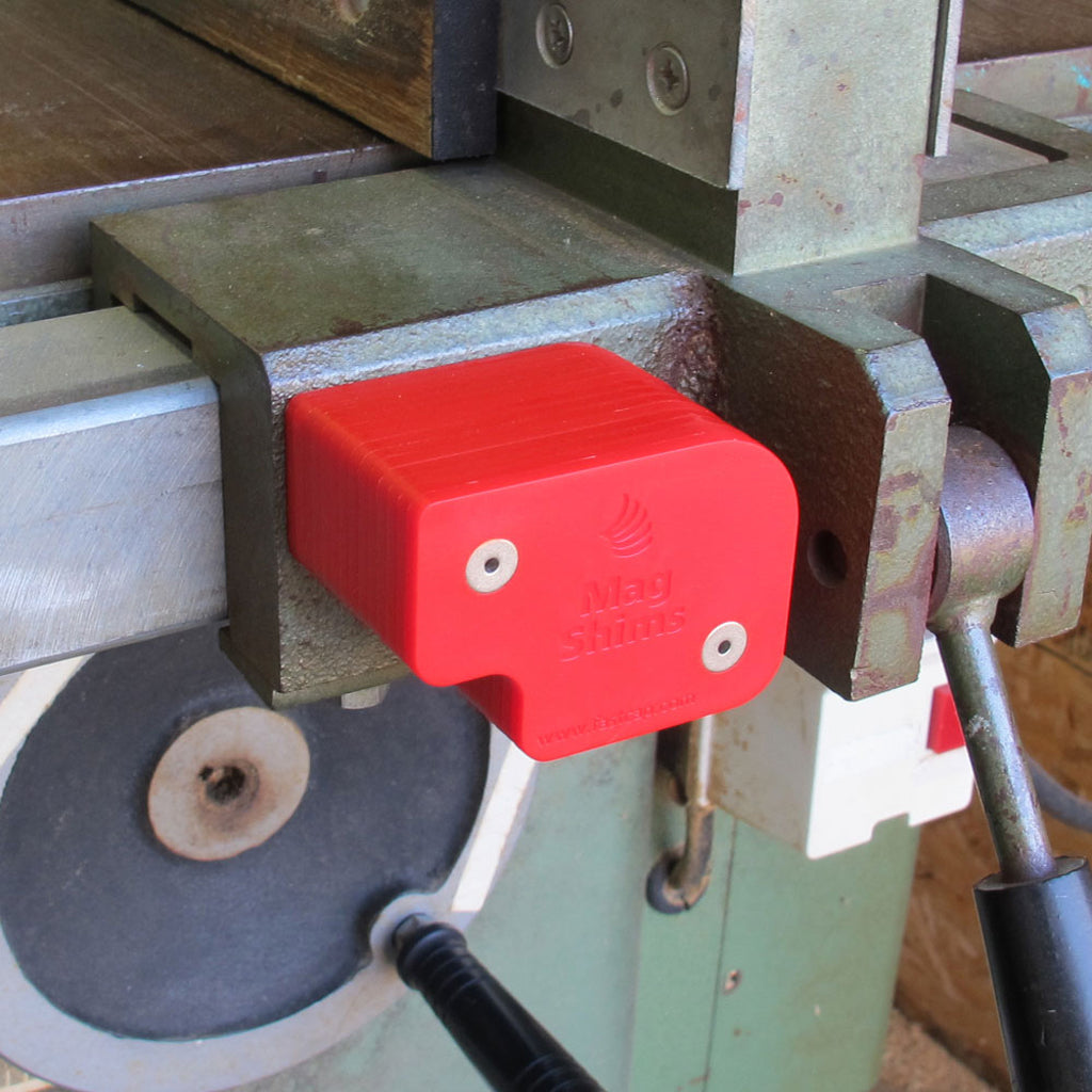 Mag Shims conveniently attach to any ferrous surface, such as this table saw's cast iron fence body.