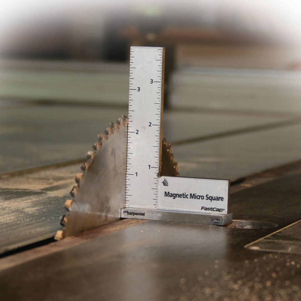 The Magnetic Micro Square attaches itself to a cast iron table saw top so the operator can easily adjust the blade square.