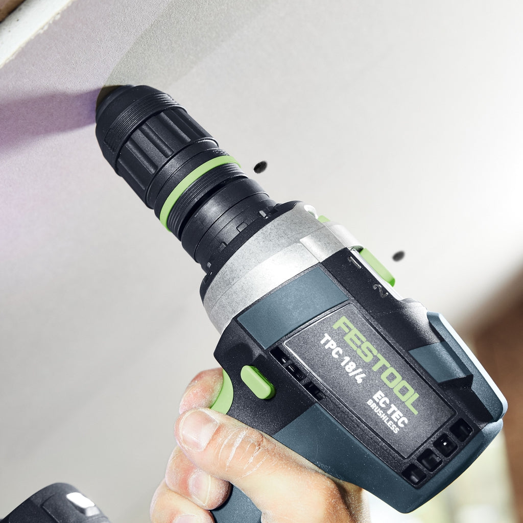 User fastens drywall with perfectly dimpled drywall screws using TPC cordless drill and depth stop chuck attachment.