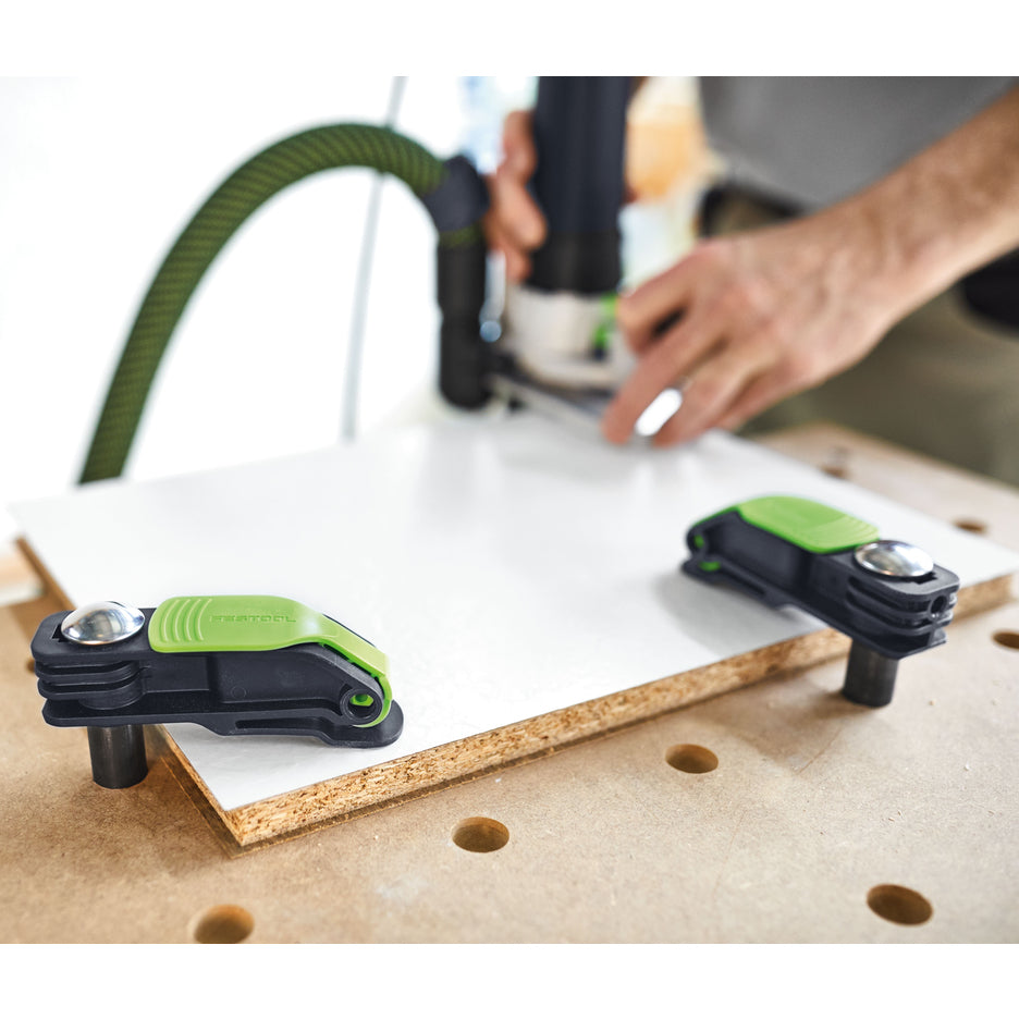 Two Festool MFT System Compatible Quick Clamps holding melamine coated particle board for routing.