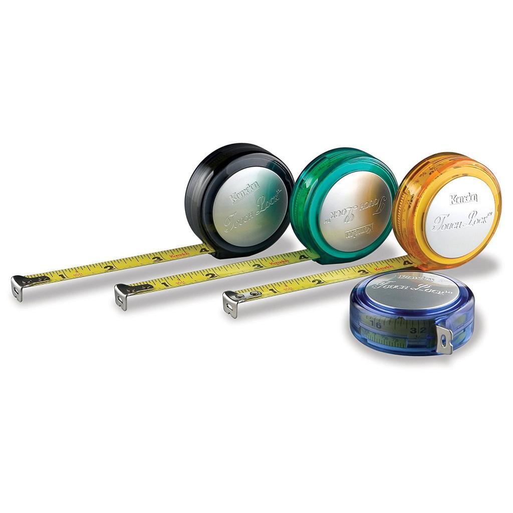 Four Komelon Touch Lock 10 tape measures with inch scales on 1/2" wide blade. Translucent coloured plastic cases.