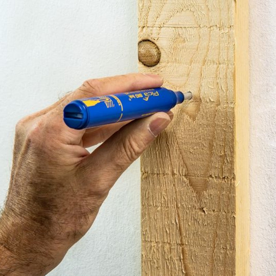 Pica Big Ink Smart-Use Marker blue transferring location of hole in wood to wall.