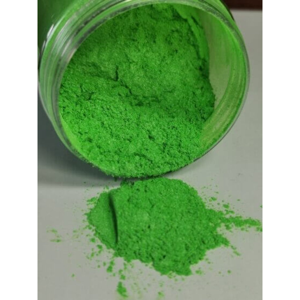A jar of Apple Green Ryver Epoxy Aurora Metallic Pigment on its side showing the actual colour and consistency of mica.
