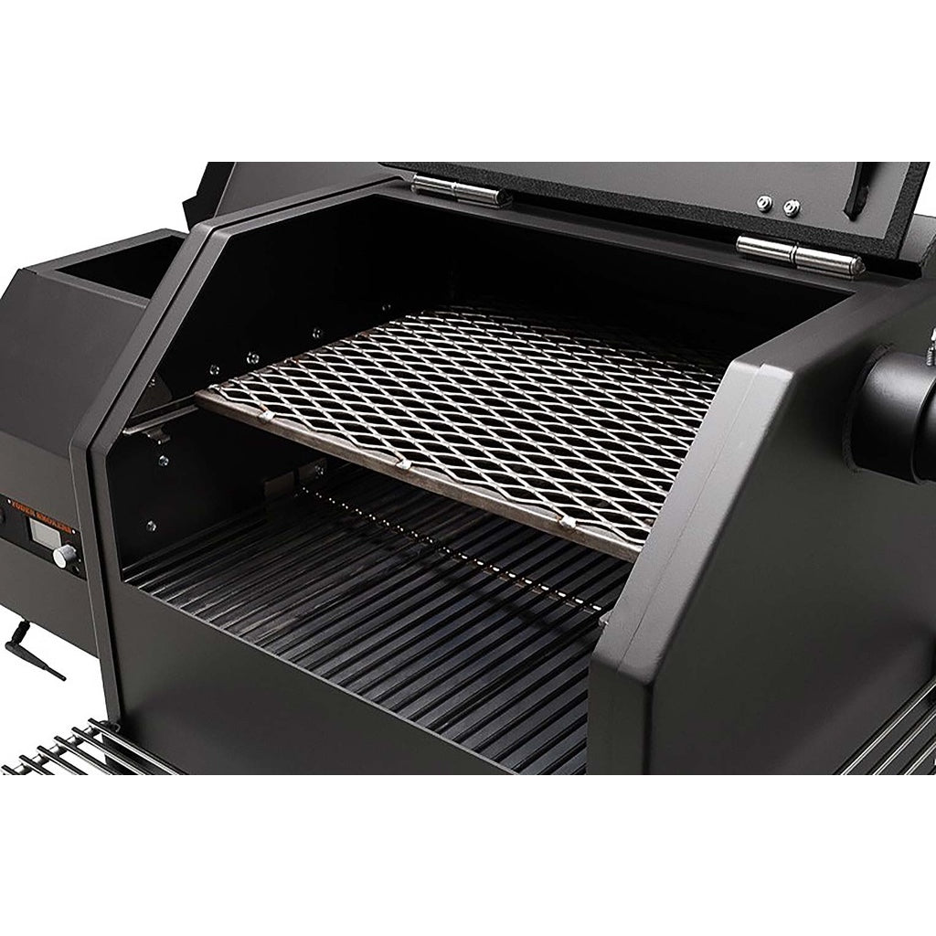 Food compartment lid open, showing pull-out second shelf and main grill of the Yoder Smokers YS480S Pellet Grill.